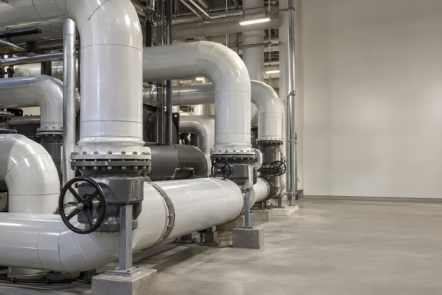 Insulated Chilled Water Pipes and Wheel Valves in a Data Center Cooling Plant Room