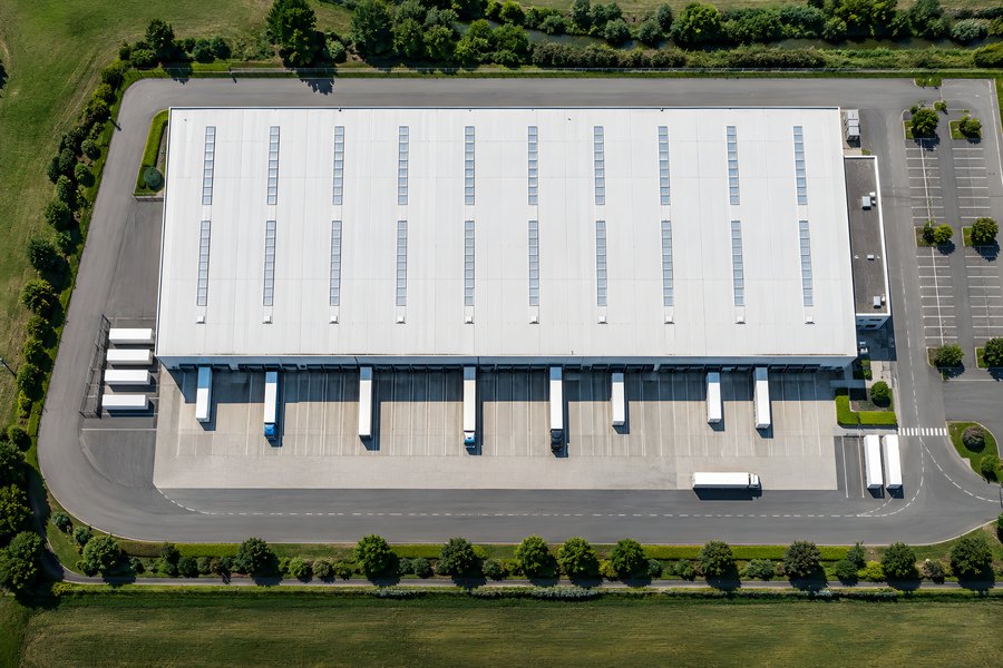 Aerial view of a distribution centre warehouse with loading docks and truck court