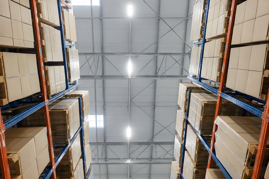 Low-Angle View of Empty High Bay Pallet Racking Aisle in a Steel-Framed Distribution Warehouse
