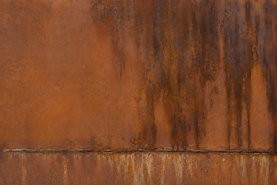 Rusted Metal Plate Texture with Vertical Rust Streaks and Weld Seam, Orange and Brown Oxidised Steel Background